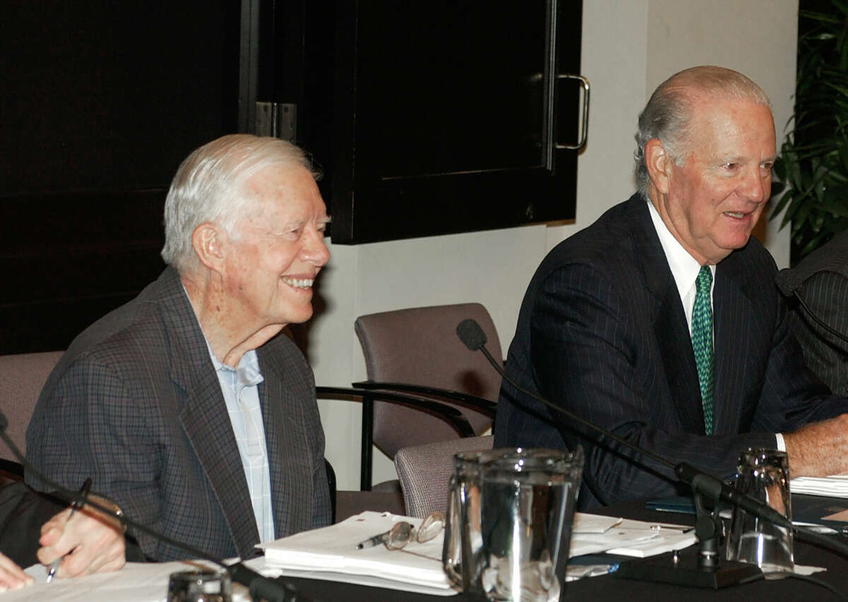 James A. Baker, III, the 61st U.S. secretary of state, and President Jimmy Carter. 