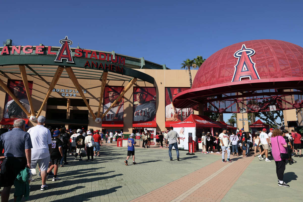 Baseball fans file into the Angel Stadium gates for an Anaheim Angels game in Anaheim, Calif.