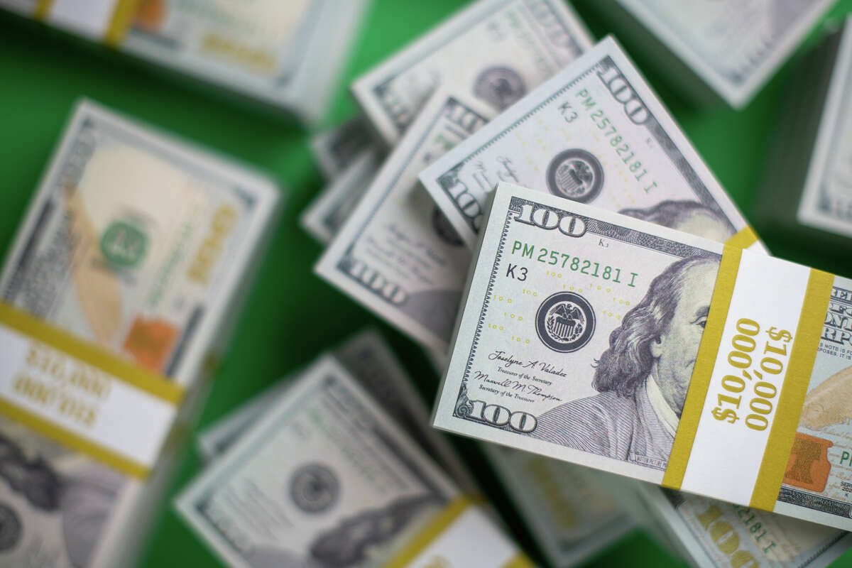 bunch of US $100 bill bundles from high angle of view, selective focus