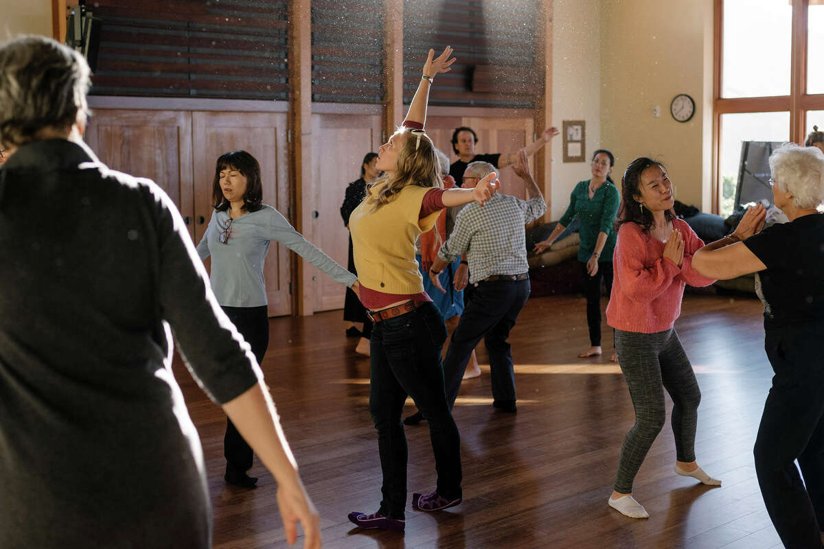 FILE: Guests begin their morning with dance awake, a chakra meditation and guitar class, at the Esalen Institute in Big Sur, Calif., Nov. 11, 2017.