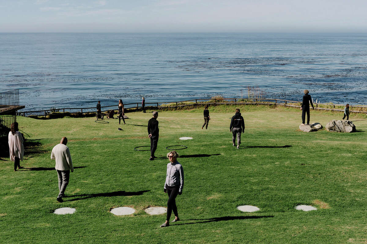 FILE: A walking meditation workshop with the Pacific Ocean as a backdrop at the Esalen Institute in Big Sur, Calif., Nov. 11, 2017.