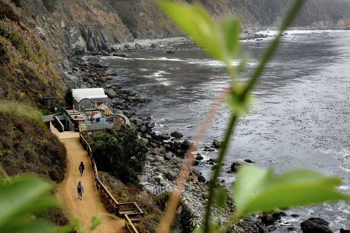 FILE: Guests travel the path to and from the hot spring baths perched on the cliffs above the Pacific Ocean, at Esalen Institute in Big Sur, Calif., on Wednesday, Sept. 12, 2012.