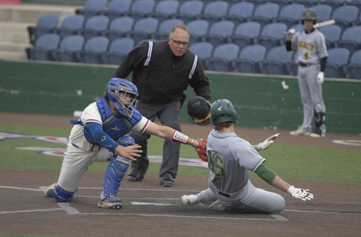 Midland Christian catcher Max Beckett tags out Frisco Legacy Christian runner Kaiden York in front of home plate umpire Dal Watson, April 28 at Christensen Stadium. 