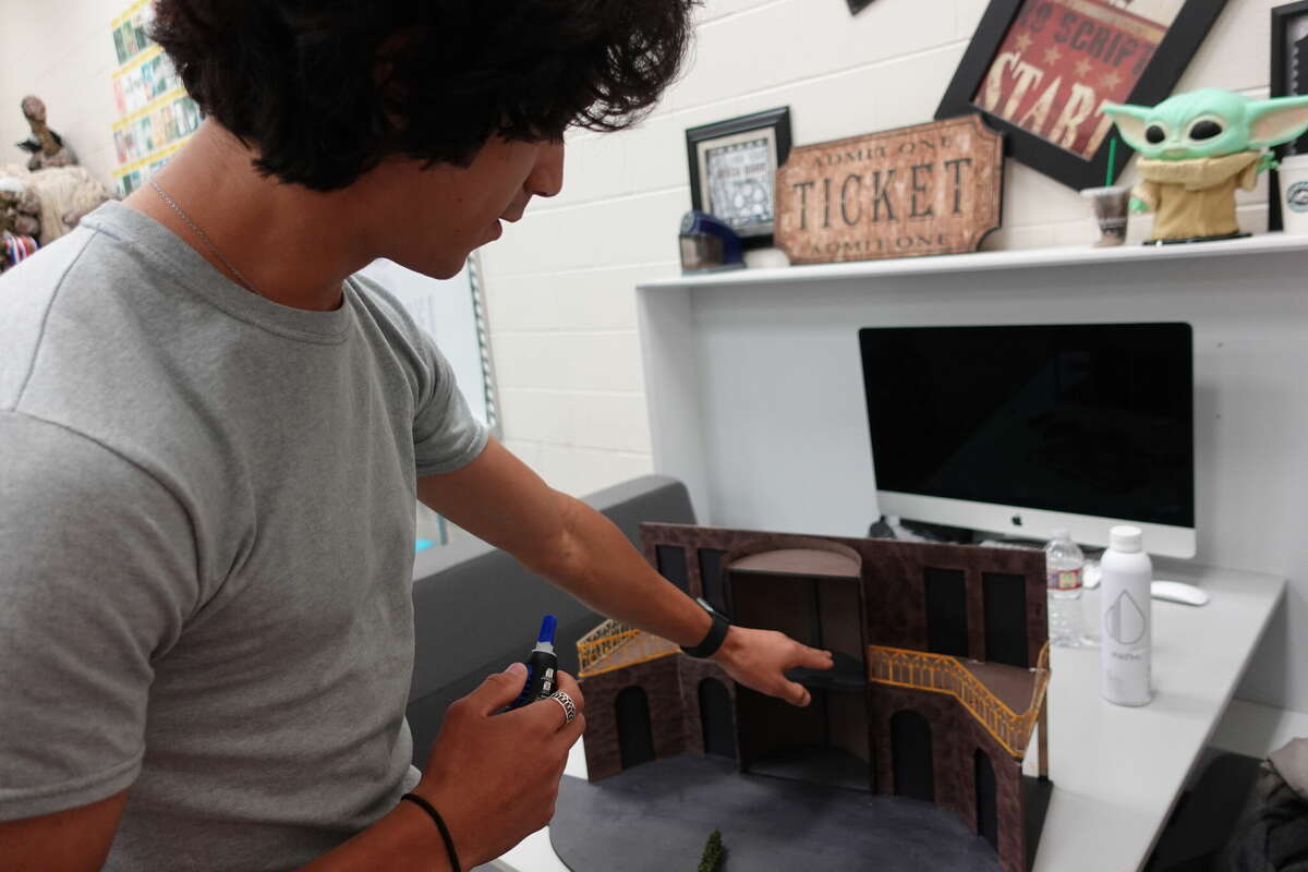 Sabine Pass senior Caleb Daniels shows his set design for the University Interscholastic League State Theatrical Design competition. Photo taken April 26, 2023. Photo by Olivia Malick/ The Enterprise.