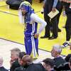 Golden State Warriors’ Stephen Curry stands by the bench in final seconds of Sacramento Kings’ 118-99 win in Game 6 of NBA Western Conference 1st Round Playoffs at Chase Center in San Francisco, Calif., on Friday, April 28, 2023.