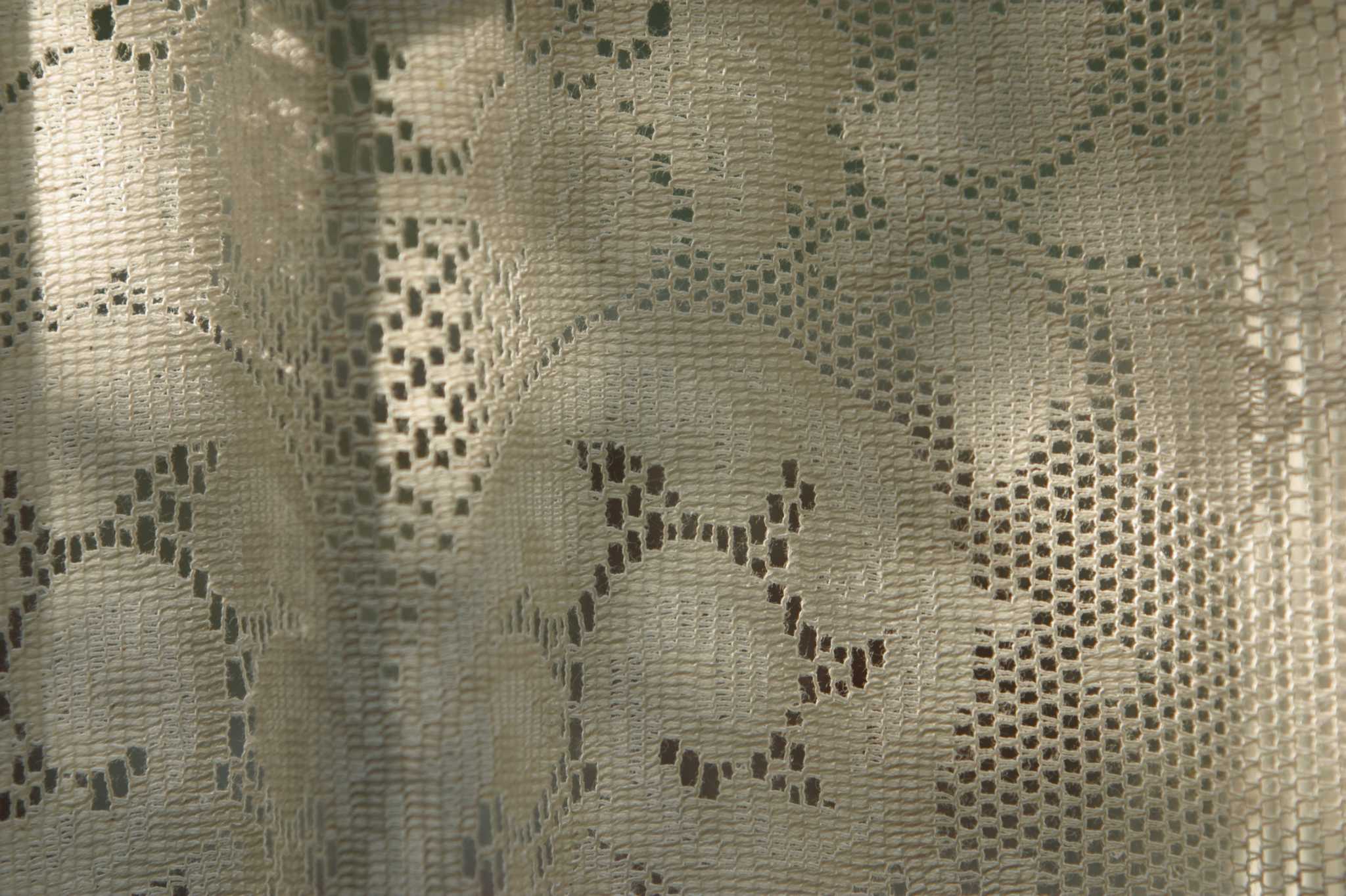 How to Cut a Shower Curtain in Half Vertically