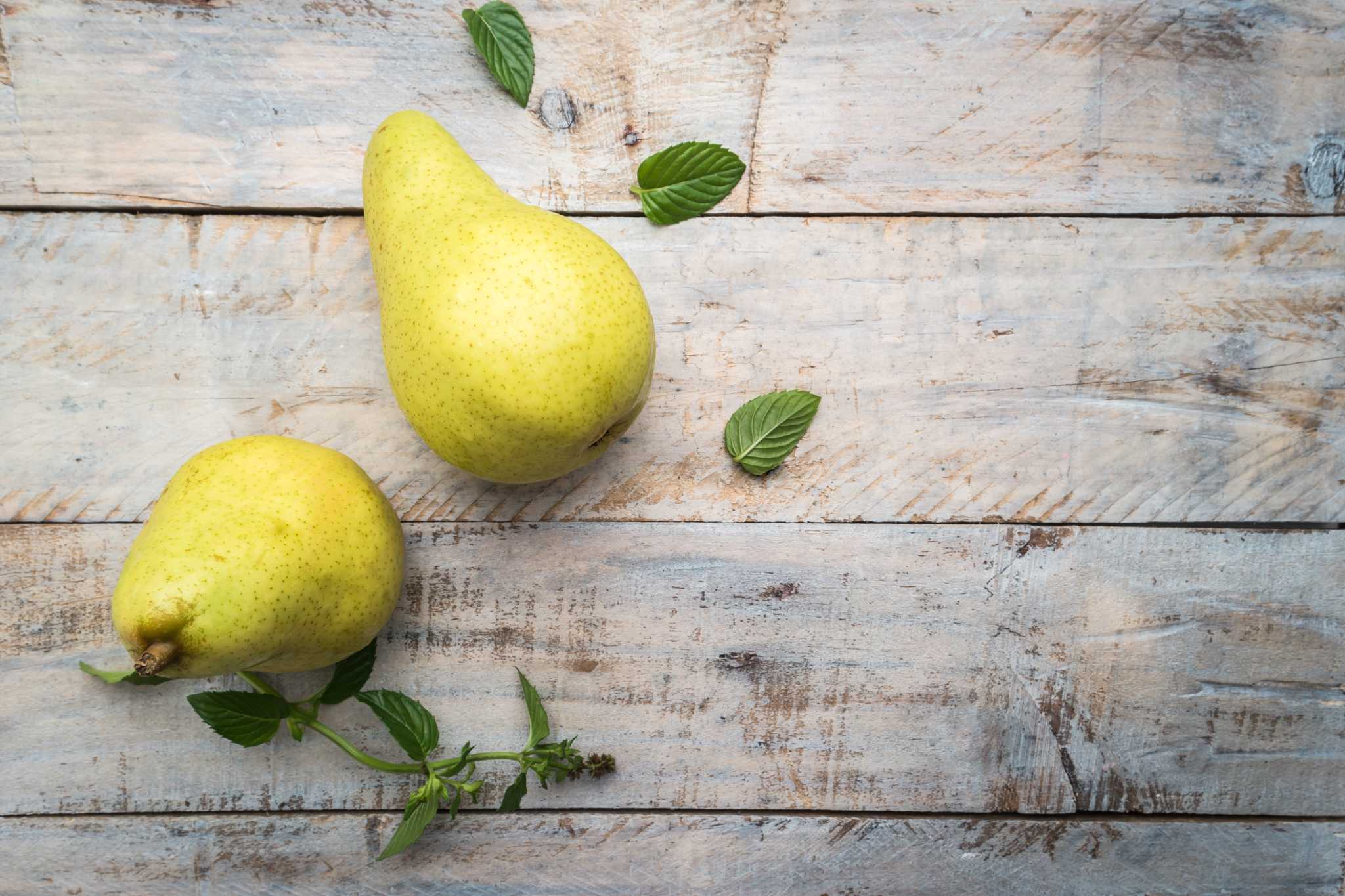 Fresh organic pears on a white background