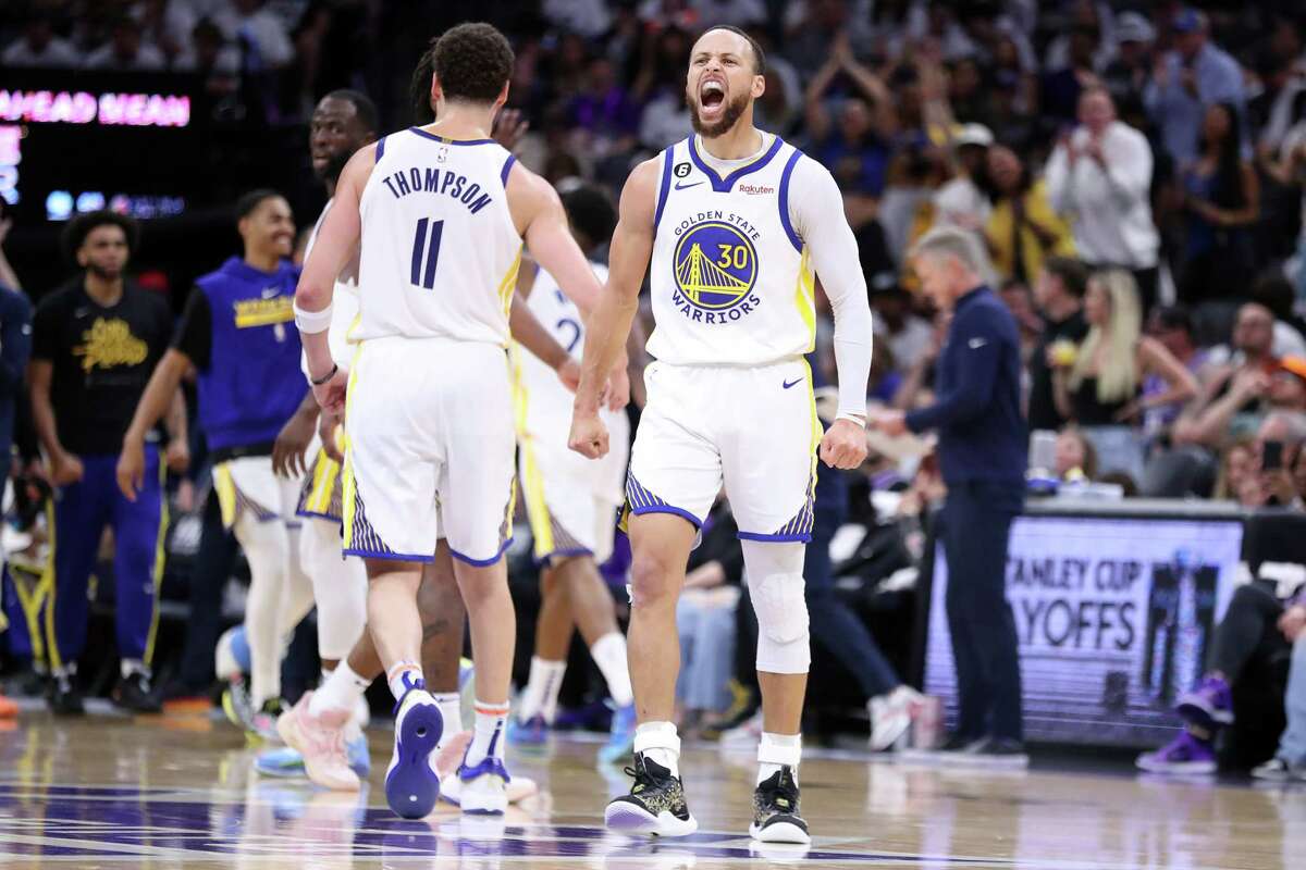 Warriors’ Stephen Curry celebrates one of his baskets against Sacramento Kings with teammate Klay Thompson during the third quarter of Game 7.