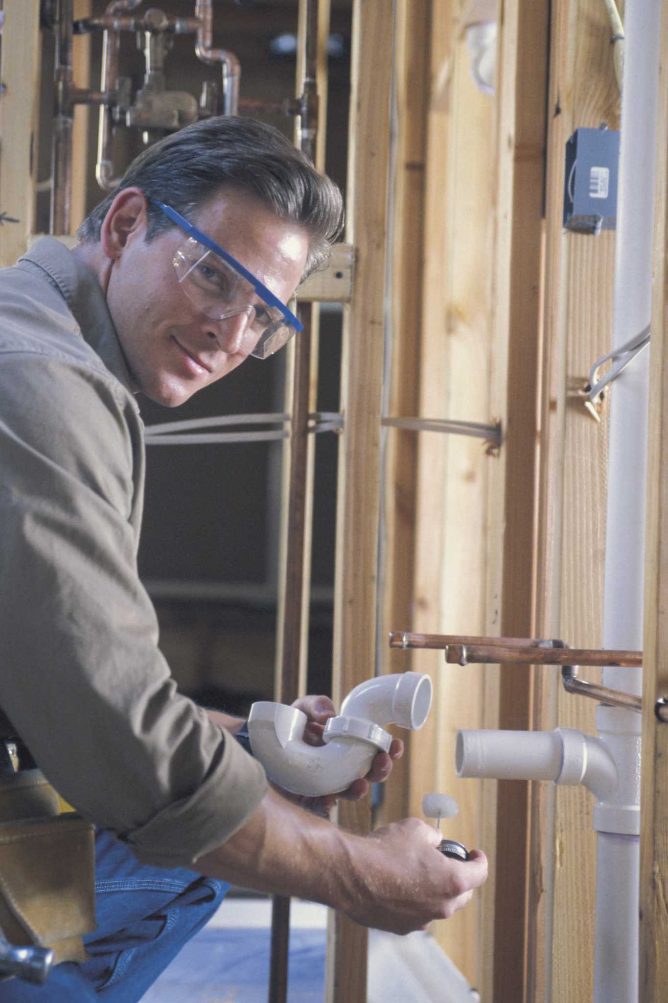 How to Glue PVC Pipes Under a Bathroom Sink