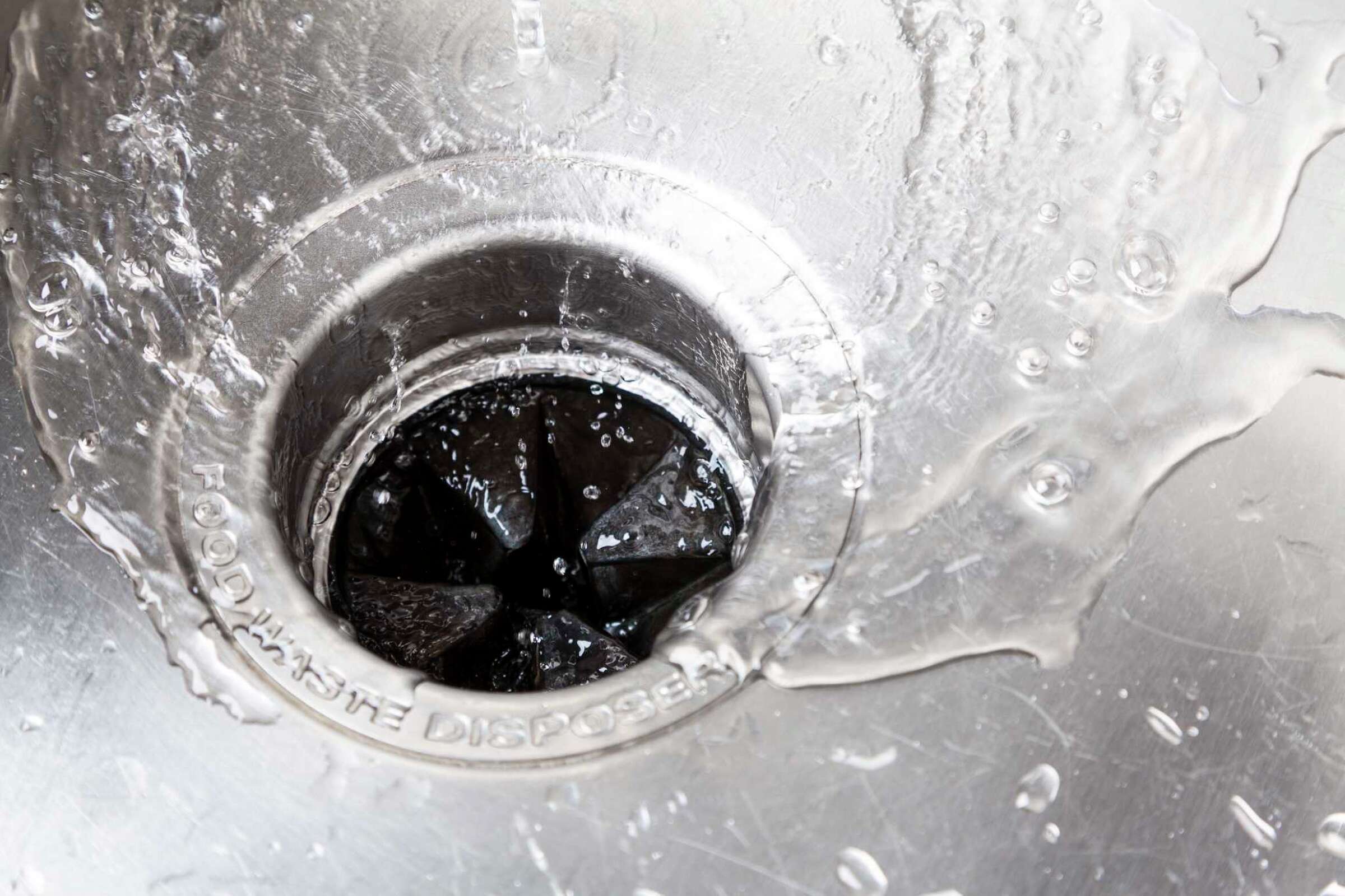 How to Fix a Slow Draining Kitchen Sink That Has a Garbage Disposal