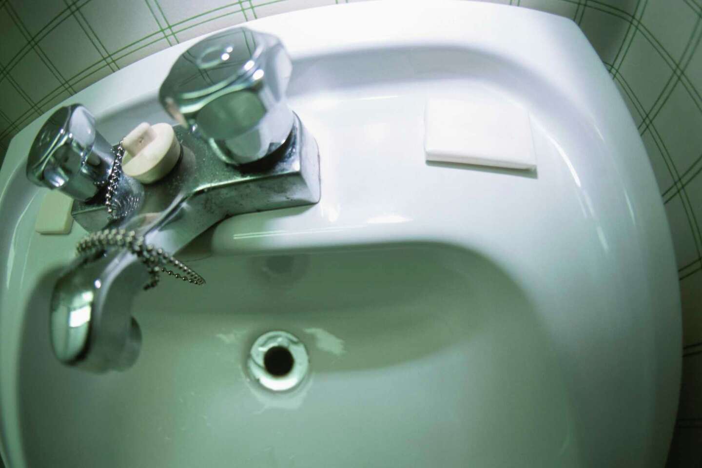 How to Drill Faucet Cutouts in a Composite Sink