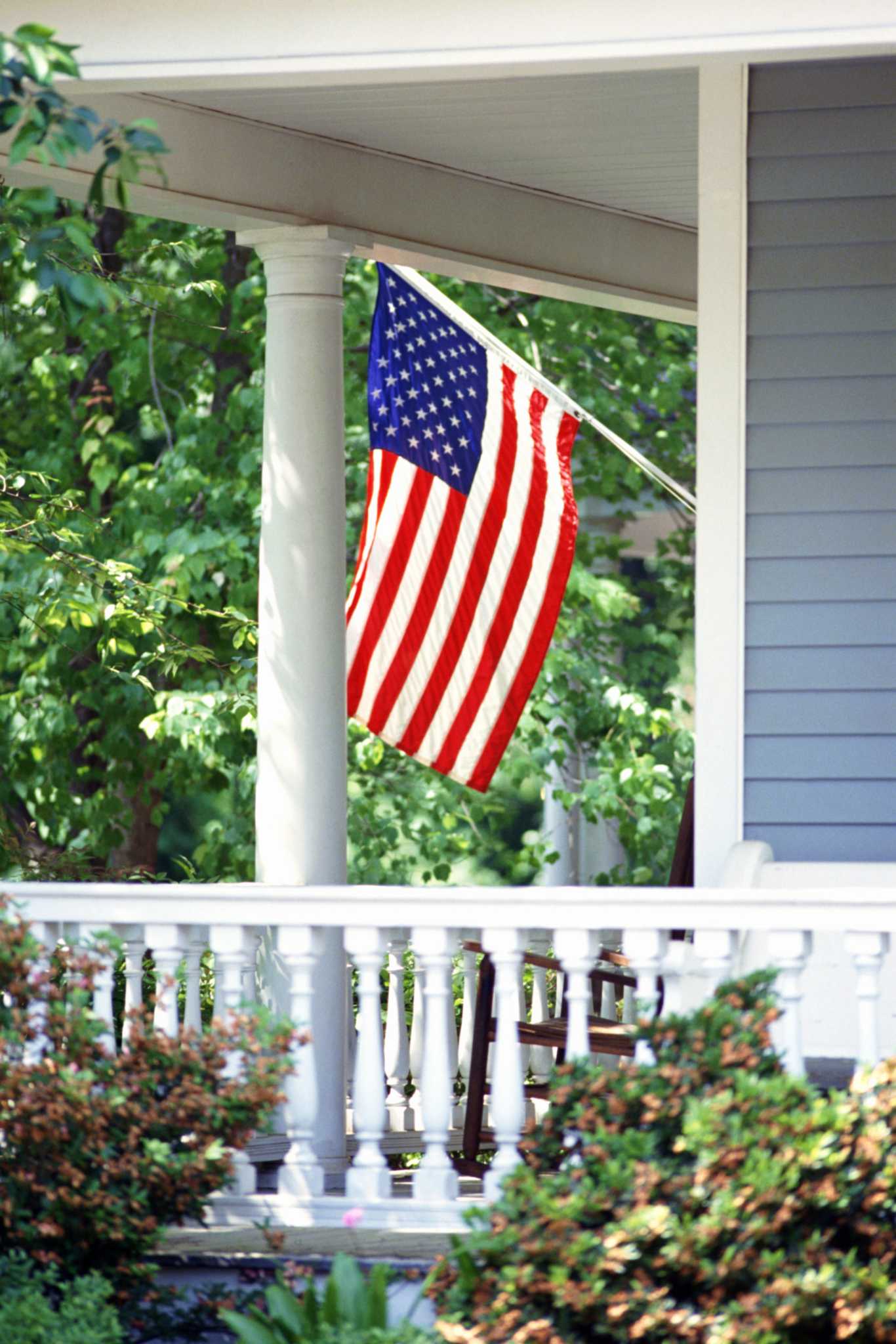 How to Attach a Flag Bracket to Aluminum Siding