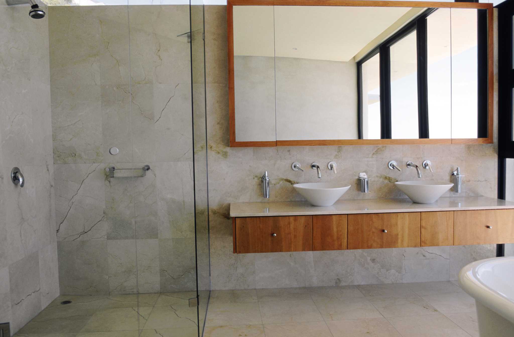 How to Attach Picture Frames to a Bathroom Mirror