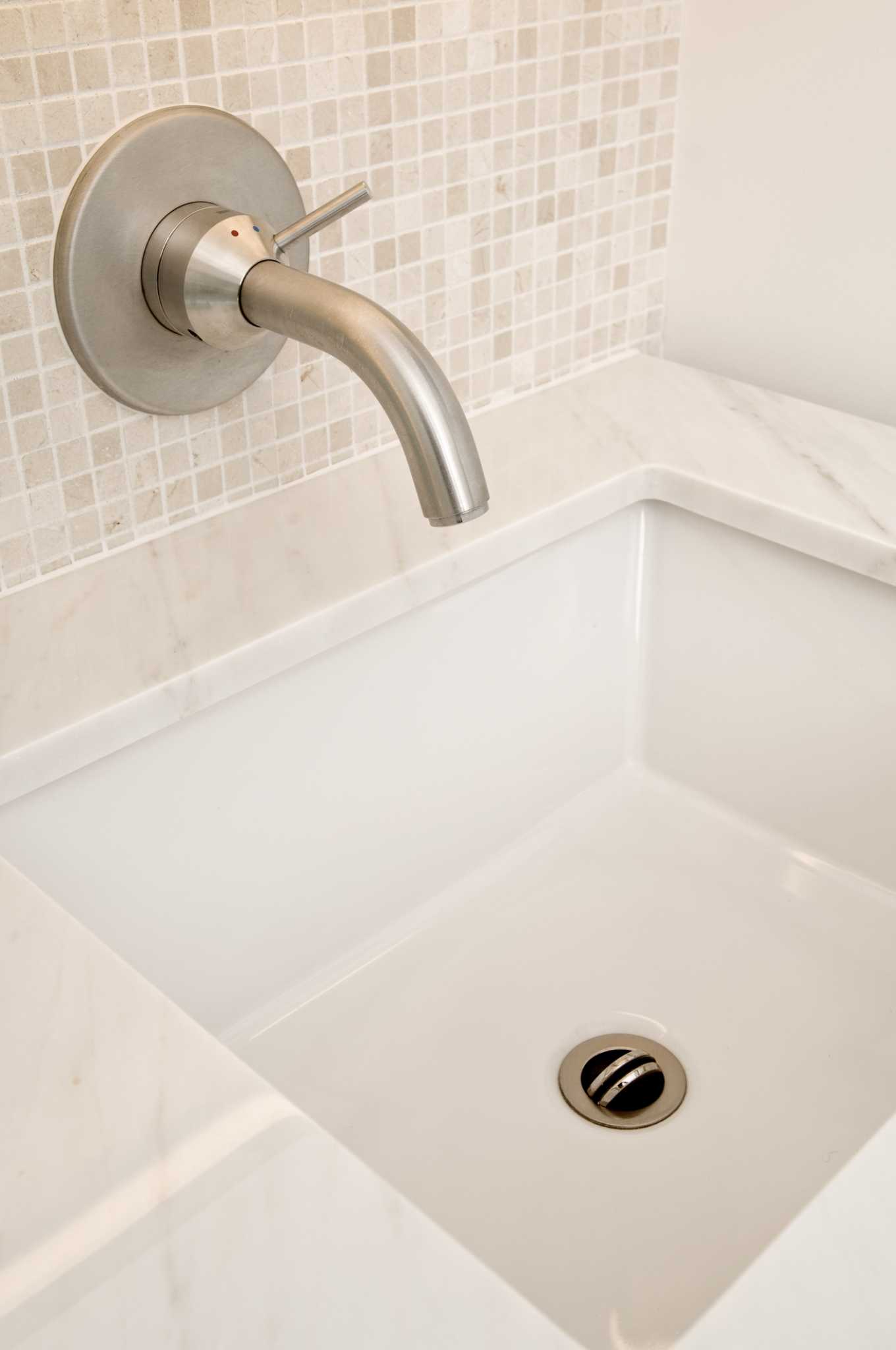 How to Fix a Bathroom Sink Pipe in a Tiled Wall