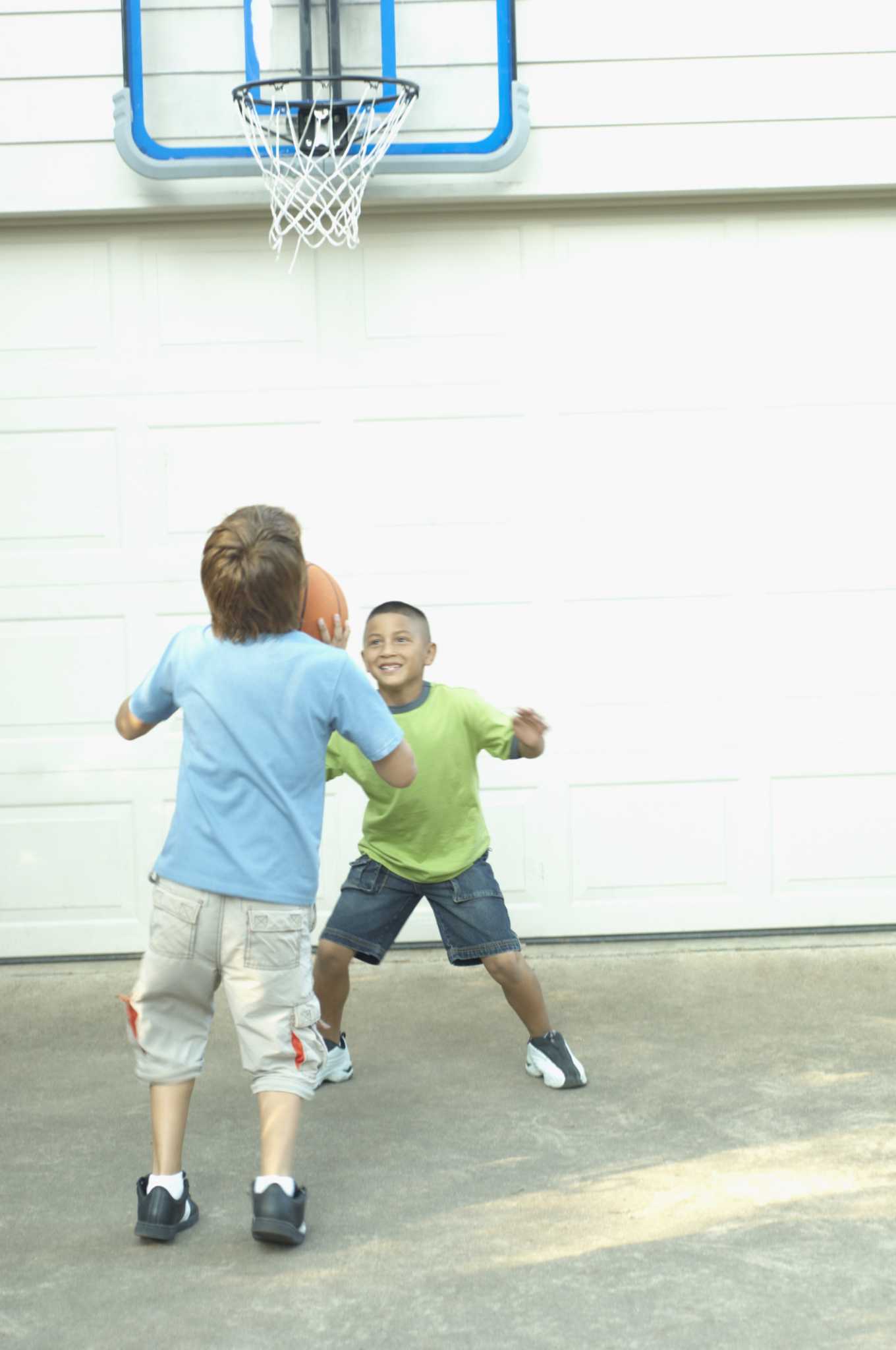 How to Install a Basketball Backboard Over a Garage