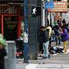 People linger on the corner of Eddy and Hyde streets in San Francisco, Calif. Monday, May 1, 2023. May 1 is the first day of CHP on the ground to combat drug dealing in San Francisco.