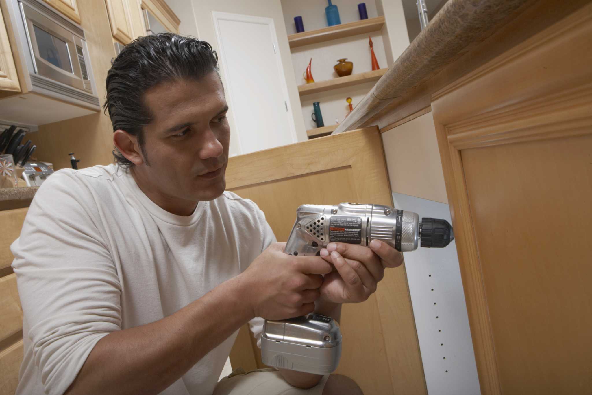 How to Install a Compact Refrigerator Into a Cabinet Base