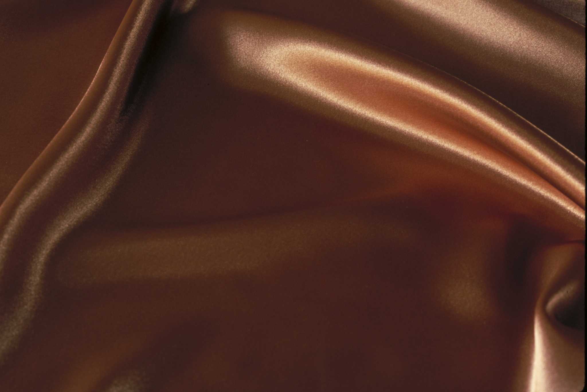 How to Keep Silk Sheets From Sliding Off the Bed