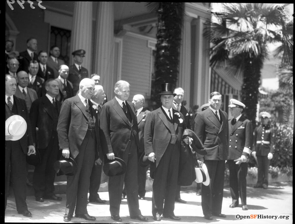 California Governor James Rolph Jr., former U.S. President Herbert Hoover and San Francisco Mayor Angelo Joseph Rossi stand in front of the admiral's residence on Yerba during the groundbreaking ceremony for the San Francisco Bay Bridge July 9, 1933 Buena Island.