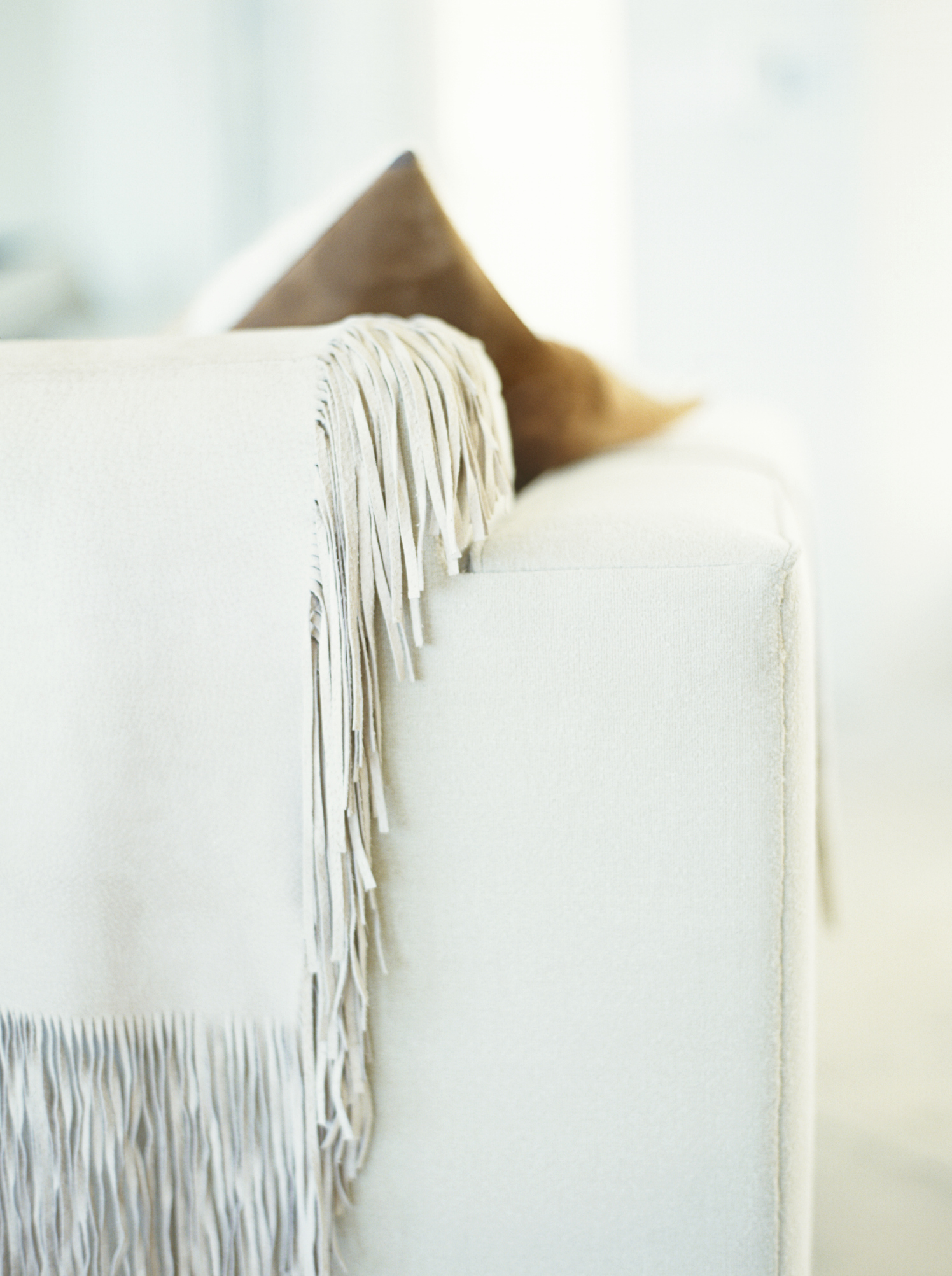 The Best Ways to Drape a Blanket on a Couch