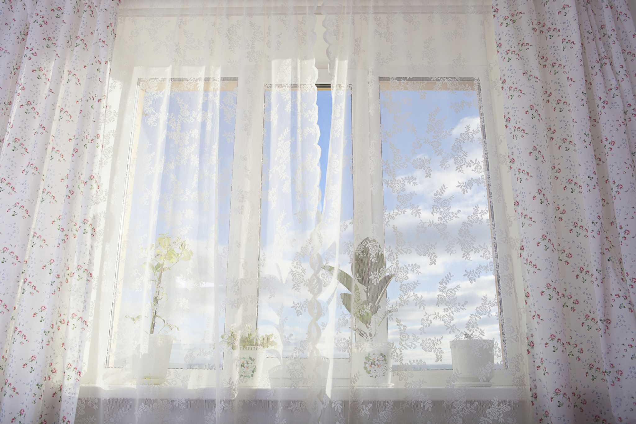 How to Put Curtains on a Long Narrow Window Above My Bed