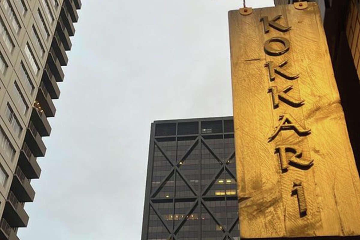 The front entrance sign of Kokkari in San Francisco at night.