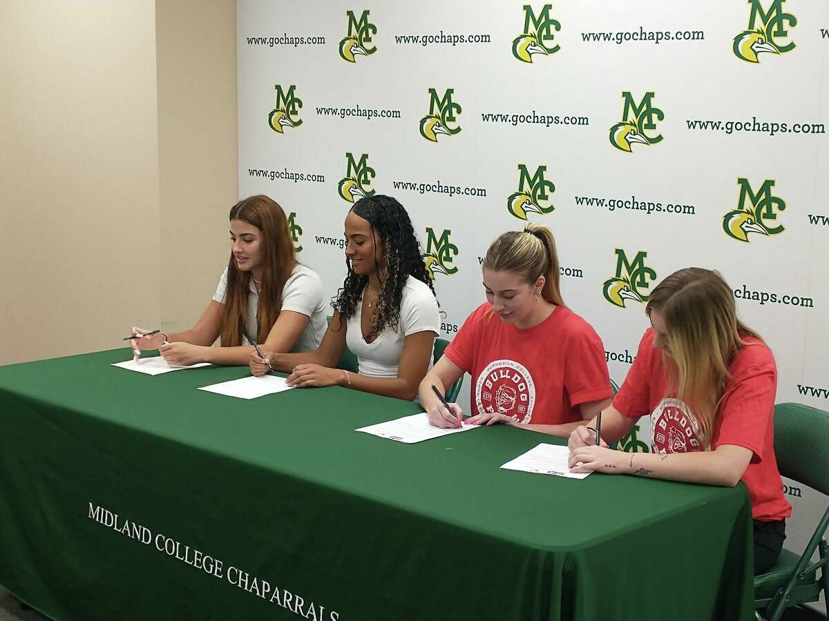 Members of the Midland College volleyball team, from left to right, Laura Milori, Linda Conceicao, Zoe Fernandez and Petra Fernandez, sign their letters-of-intent on 5/3/2023. 