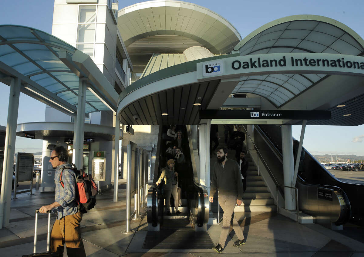 FILE: Airport passengers arrive at Oakland International Airport on Wednesday, Nov. 25, 2015.