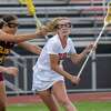 Bethlehem midfielder Mae Conway takes a shot in front of Colonie defender Mia Tyler on Thursday, May 4, 2023, at Bethlehem High School in Delmar, NY.