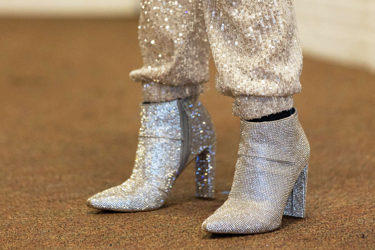 A student in "The Art of Drag" weekend workshop wears sparkly heeled booties while performing in the Youth Actor's Theatre Camp showcase in Ben Lomond on April 2, 2023. 