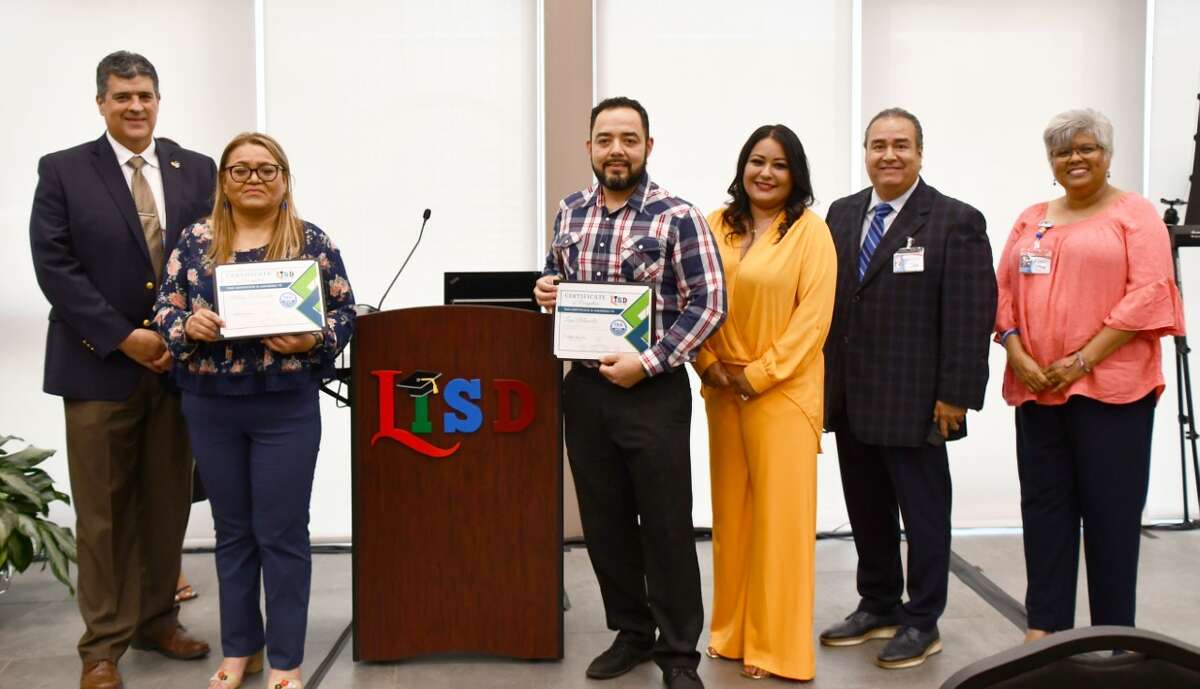 From left to right, LISD Assistant Superintendent of Curriculum and Instruction Dr. Gerardo Cruz, Cigarroa Middle School Teacher Maria Villarreal, Memorial Middle School Teacher Luis Mancillas, LISD Board President Monica Garcia, LISD Board Trustee Goyo Lopez, and Board Trustee Veronica V. Orduño, during a ceremony to recognize 39 middle school teachers who will receive the Texas Education Agency Teacher Incentive Allotment, at the LISD Performing Arts Complex on Wednesday, May 3, 2023.