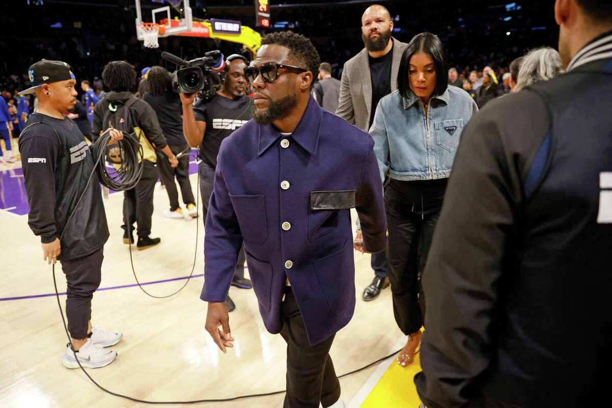 Comedian and actor Kevin Hart takes his seat to watch Game 3 of the NBA Western Conference semifinals between the Golden State Warriors and the Los Angeles Lakers in Los Angeles, Calif., Saturday, May 06, 2023.