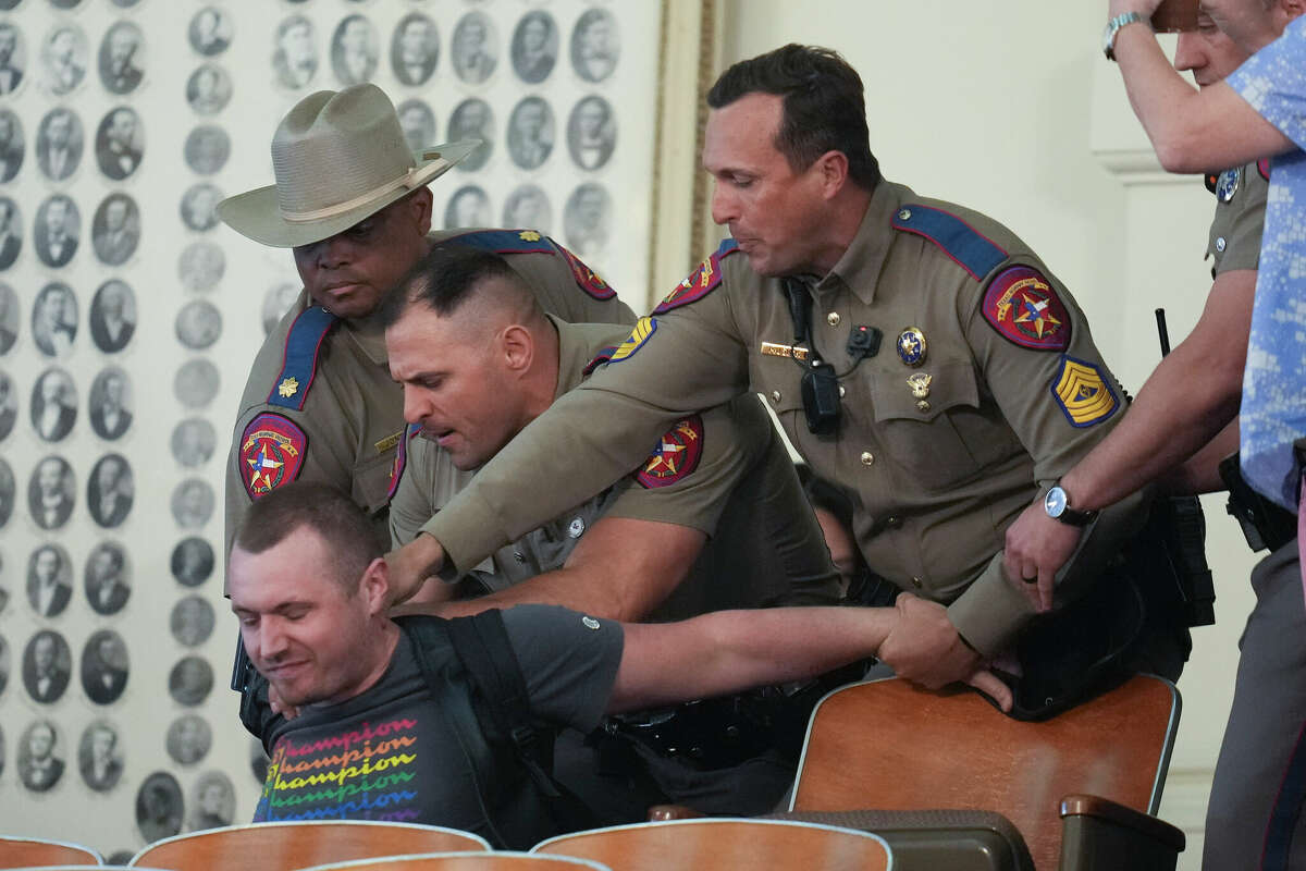 Story photo for LGBTQ protester charged with assault says his hat brushed trooper