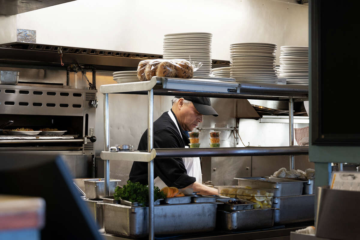 Chef prepares food for customers at Barbaraʻs Fishtrap in Half Moon Bay Calif., May 4, 2023