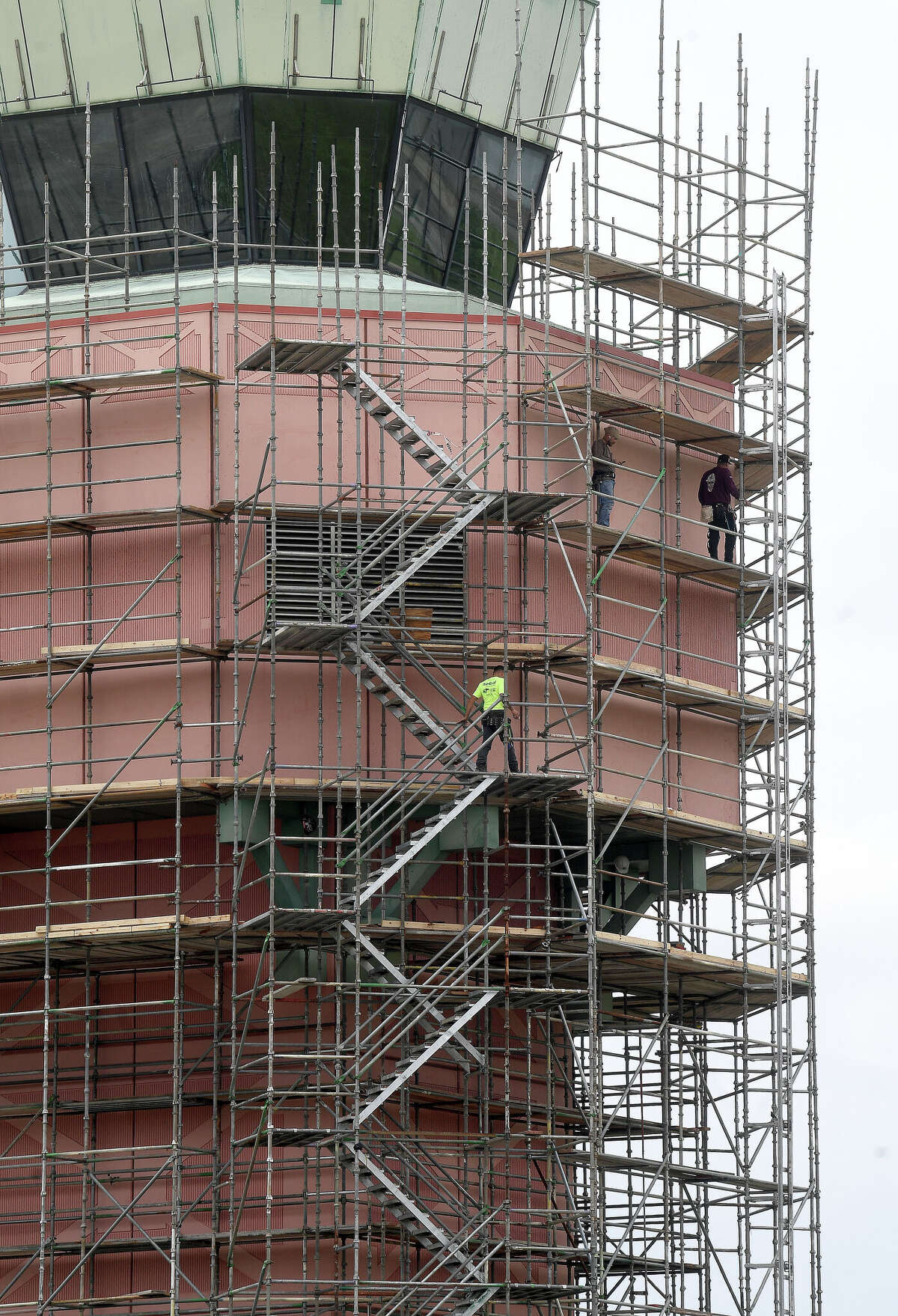 Scaffolding covers Jack Brooks air control tower for renovations