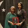Beaumont ISD Superintendent Shannon Allen, right, presents Career and Technical Education Center teacher Bettina Evans, left, her plaque at the 2023-24 Teacher of the Year Celebration of Excellence Gala held on May 5, 2023, at the Beaumont Civic Center.
