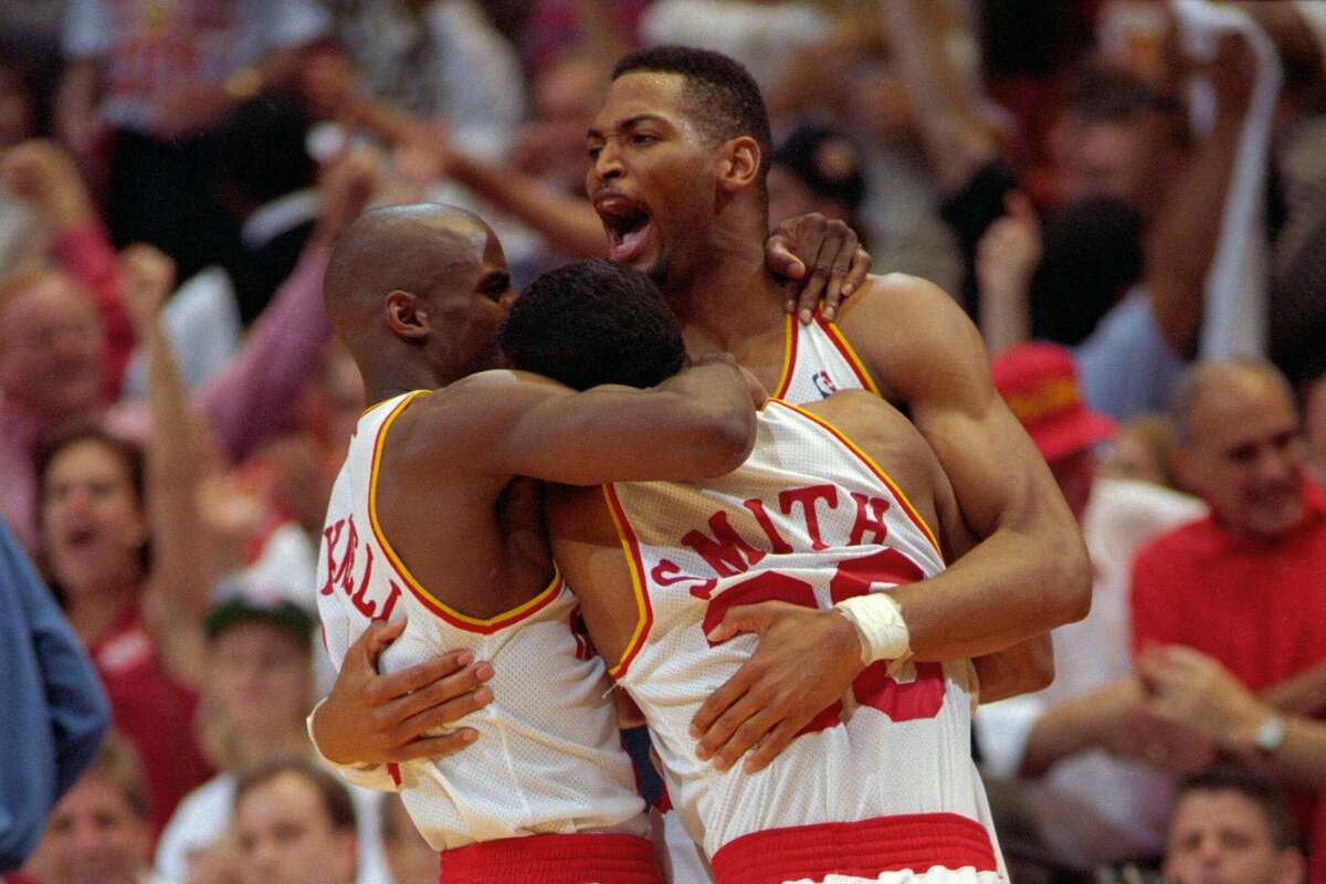 Houston Rockets teammates Vernon Maxwell, Kenny Smith, and Robert Horry celebrate after the Rockets won the NBA Championship beating the New York Knicks on June 22, 1994.