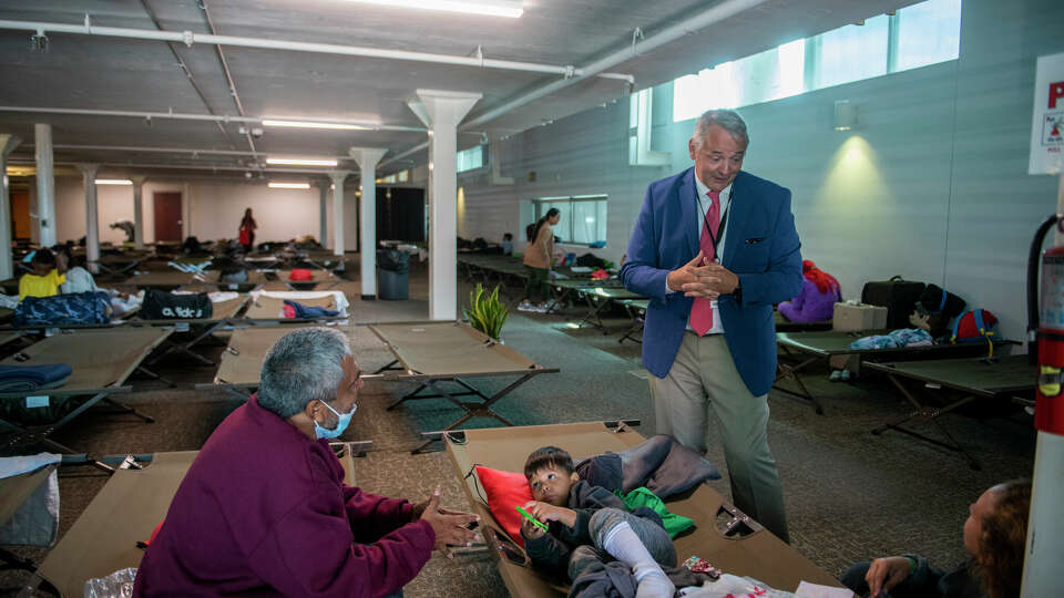 Antonio Fernandez, Catholic Charities president and CEO, talks about how the center has adapted to shifting numbers of asylum seekers, and what he expects in May, when Title 42 ends while giving a tour at the center.