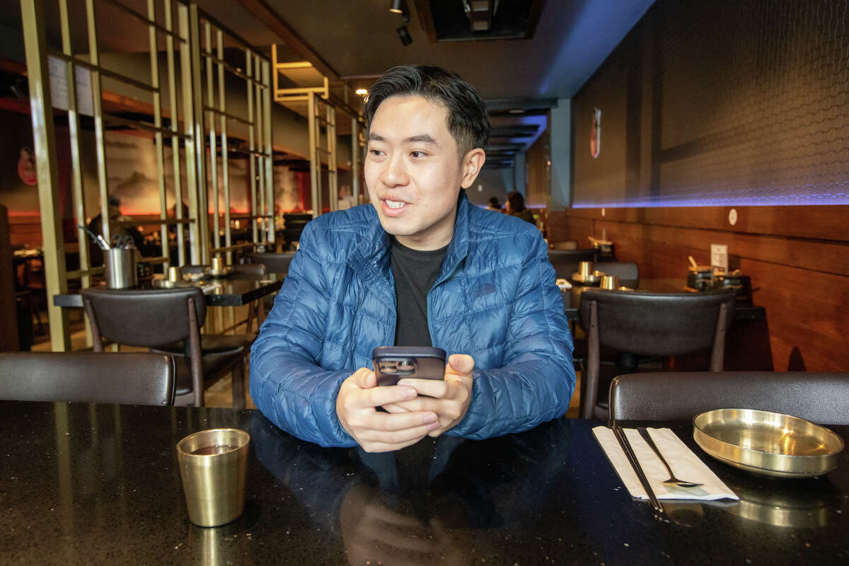 Tim Cheung of Bay Area Foodies talks about the menu at Daeho Kalbijjim & Beef Soup in San Francisco on May 9, 2023. He is a social media influencer with hundreds of thousands of followers on Instagram and TikTok.