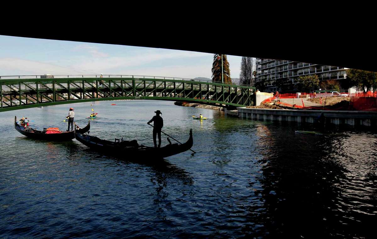Gondolas were among the first vessels to paddle into and out of a newly reopened 750-foot-section of the Lake Merritt channel Feb. 22, 2013.