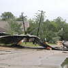 Part of the metal roof came flying of a building owned by Ninth and Elm Church of Christ landed on top of a powerline on the corner of 9th Street and W Elm Avenue in Orange. Photo taken Tuesday, May 9