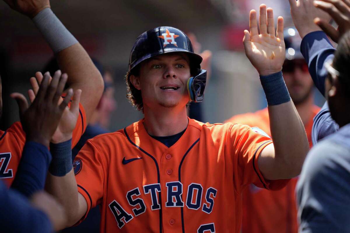 Houston Astros' Jake Meyers (6) celebrates in the dugout after scoring off of a single by Jeremy Pena during the fourth inning of a baseball game in Anaheim, Calif., Wednesday, May 10, 2023. David Hensley also scored.