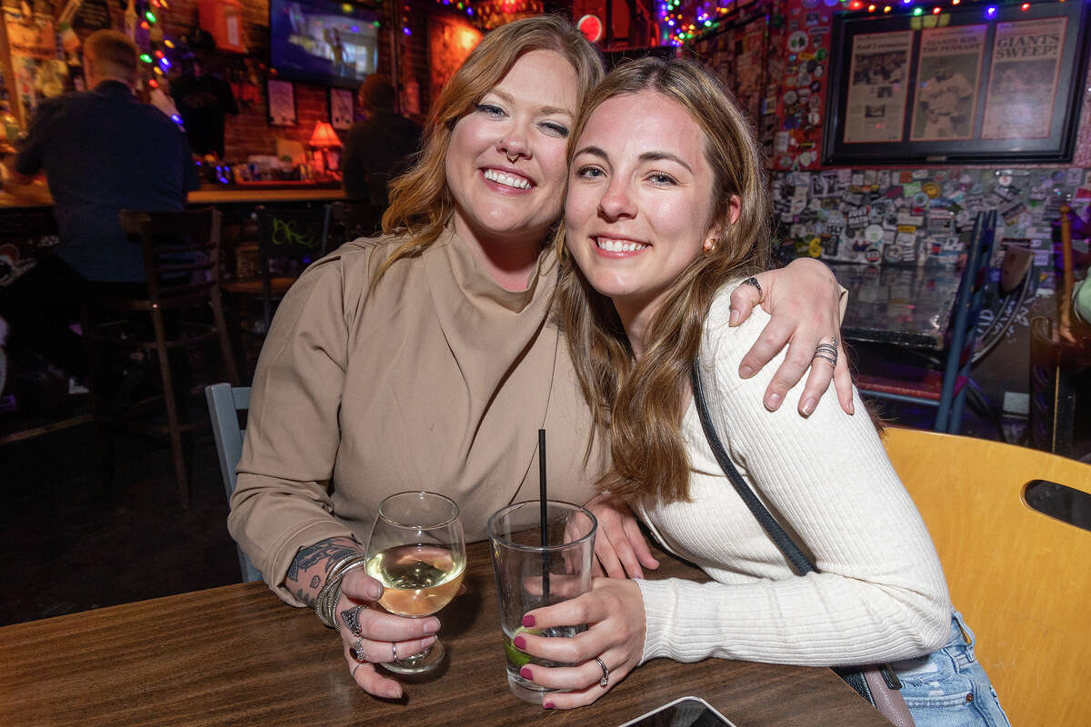 Old friends Abby Tornquist of Seattle, left, and Cassie Simpson of Chaska, Minnesota catch up at Tempest while visiting San Francisco on Sunday night, May 7, 2023.