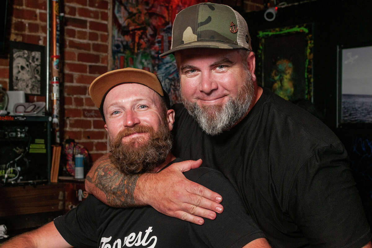 Joey Christensen, left, and Tony Cooney, co-owners of Tempest, kick back at the SoMa District bar after catering a private party on Aug. 25, 2022.