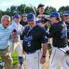 Hoosick Falls head baseball coach Mike Lilac Jr. is doused with water while giving a television interview after beating Waterford-Halfmoon on Thursday, May 11, 2023, at Hoosick Falls High School in Hoosick Falls, NY. The win gives him his 400th career victory.