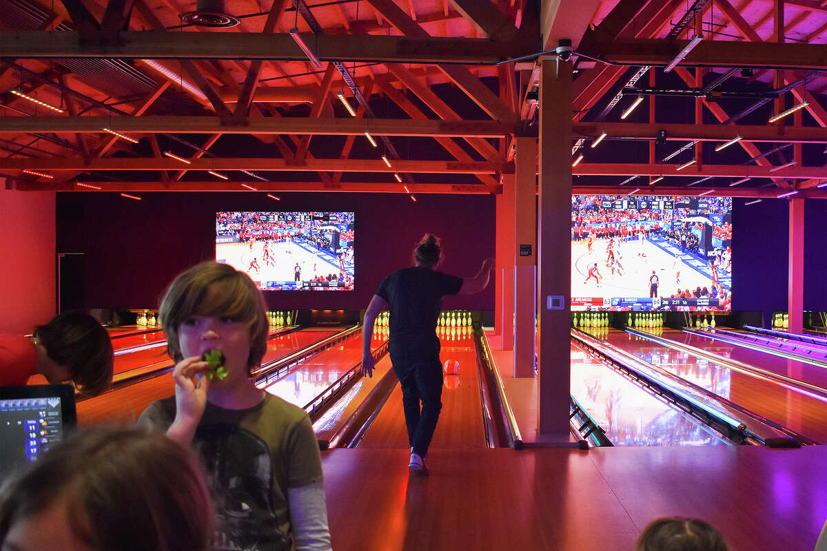 A young bowler enjoys some poke nachos at the recently refurbished Bowl Incline in Incline Village, Nev.