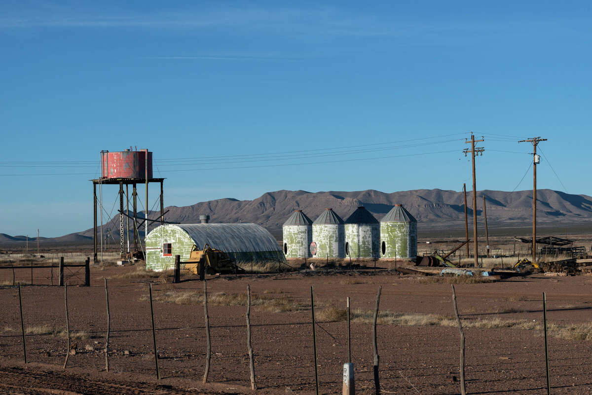 Weathered metal structures in the mostly deserted town of Lobo, south of Van Horn on U.S. 90 in Culberson County, Texas.