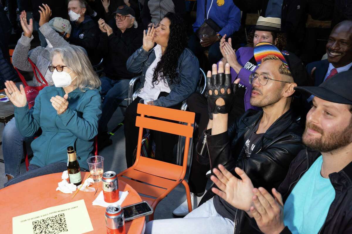 A group cheers during a candidate forum featuring Reps. Barbara Lee and Katie Porter at El Rio in San Francisco Friday. Both are candidates for a U.S. Senate seat.