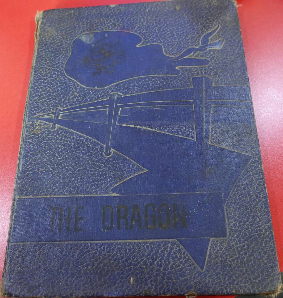 The first yearbook of what was then known as Henderson High School, prior to integration of the Hardin-Jefferson schools. The school was named for Principal James H. Henderson, the first Black principal at the school. The 1958-59 yearbook, "The Dragon," was created by the senior class. Photo taken May 11, 2023. Photo by Olivia Malick/ The Enterprise.