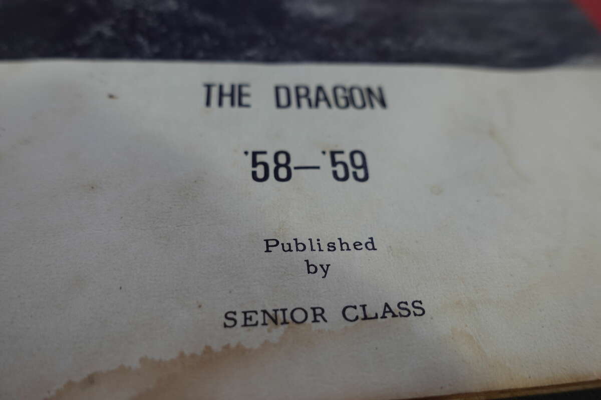 The first yearbook of what was then known as Henderson High School, prior to integration of the Hardin-Jefferson schools. The school was named for Principal James H. Henderson, the first Black principal at the school. The 1958-59 yearbook, "The Dragon," was created by the senior class. Photo taken May 11, 2023. Photo by Olivia Malick/ The Enterprise.
